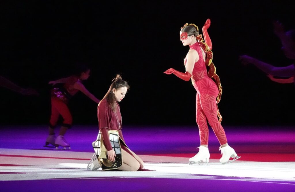 Two women performing a drama on the ice
