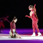 Two women performing a drama on the ice