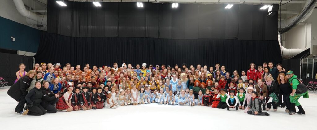 A close-up of all the performers posing for a picture