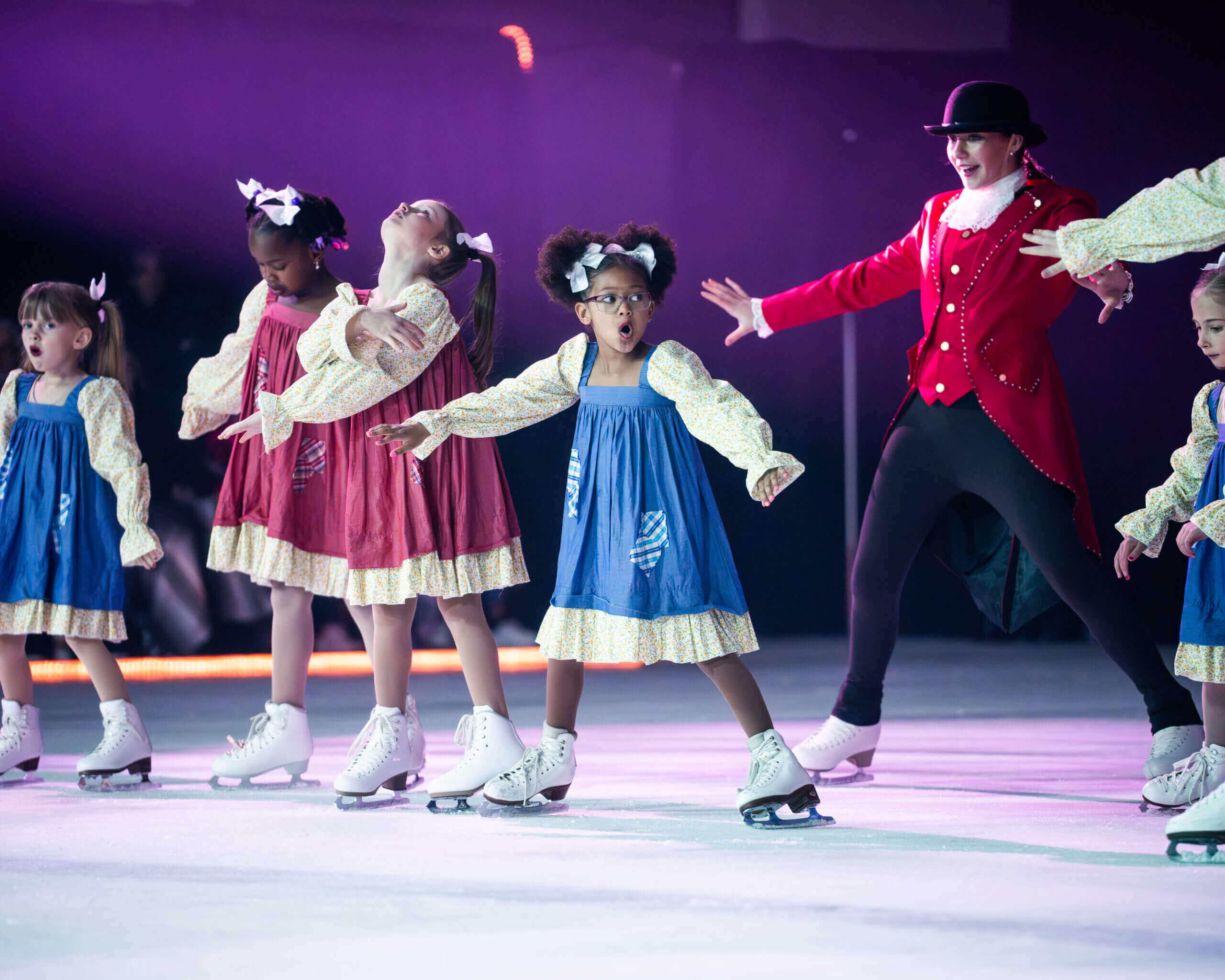 Young figure skaters performing on ice.
